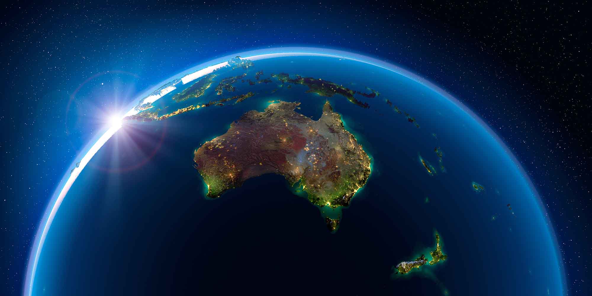 Sunrise over Earth highlighting Australia from space.